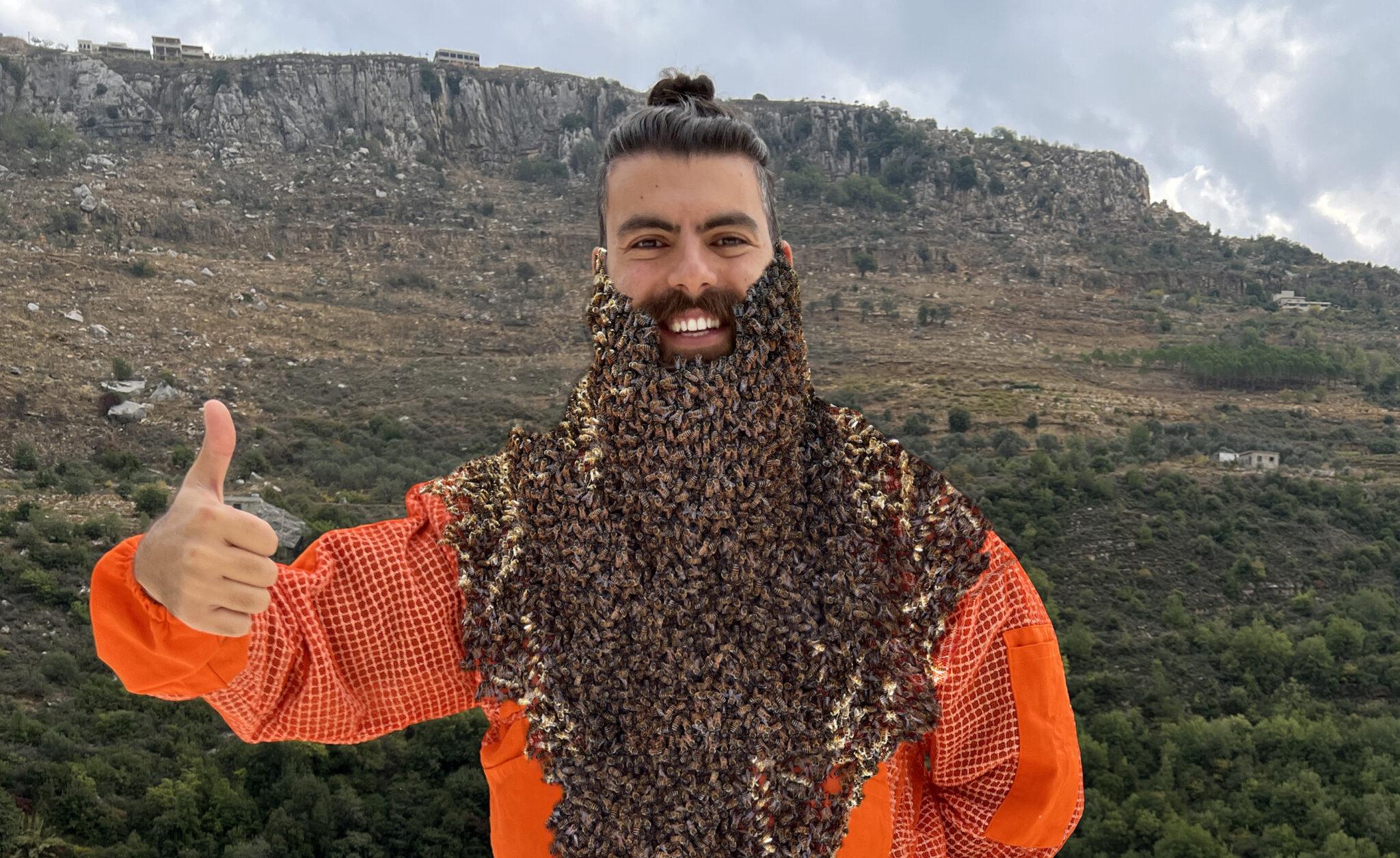 Beekeeper working with hives
